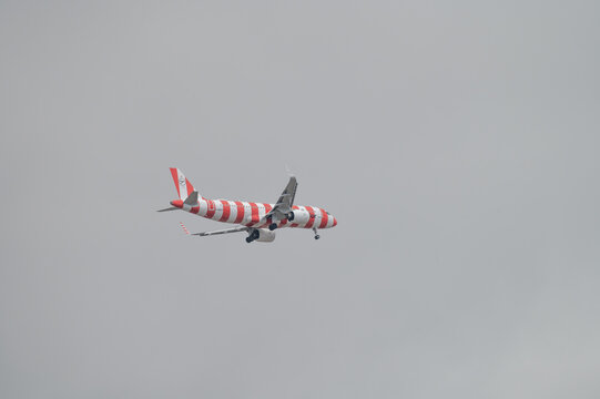 Condor Airlines striped aircraft descending toward Tenerife South Airport
