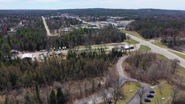 Drone with distant view of downtown Mio Michigan in Oscoda County.