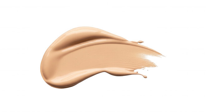 A smear of beige liquid foundation makeup showing smooth texture and creamy consistency isolated on a solid black background surface