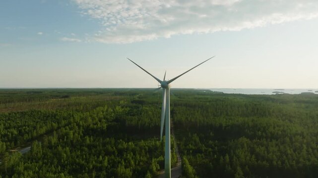 Sustainable Wind farm infrastructure in lush green forests of Southern Finland