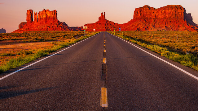 Red cliffs of Monument Valley in Utah, looking south on U.S. Route 163  north of the Utah&ndash;Arizona state line also known as Forrest Gump point early in the morning sunrise.