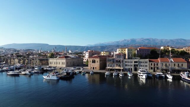bay of Chania with sea and lighthouse at sunny summer sunset, Crete, Greece,