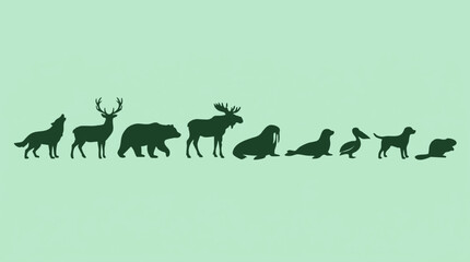Diverse animal silhouettes set in a line on a light green background © Tahphoto