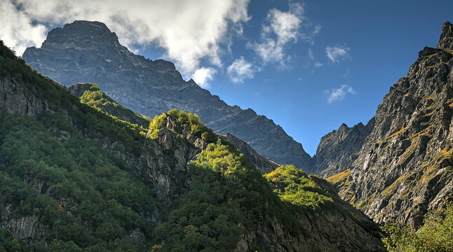 The photo shows a beautiful view of the Caucasus Mountains and the gorges.