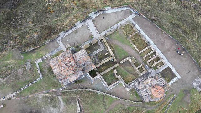 Aerial zoom in view Sevanavank monastic complex. Peninsula at the northwestern shore of Lake Sevan in the Gegharkunik Province of Armenia. Group of tourist visit popular travel sightseeing attraction