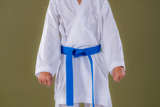 Boy standing in the basic karate stance Heisoku Dachi with aligned feet and upright posture. Highlights balance, discipline, and foundational martial arts form.