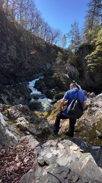 Lone Hiker at Conwy Fall Waterfall, Betws Y Coed, Snowdonia National Park, North Wales, United Kingdom