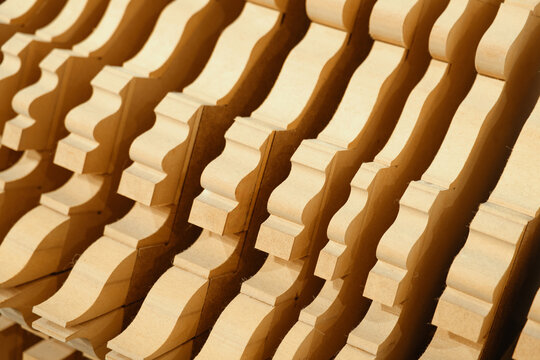 Abstract architectural detail of wooden geometric structures with repetitive patterns. Modern interior design and woodwork
