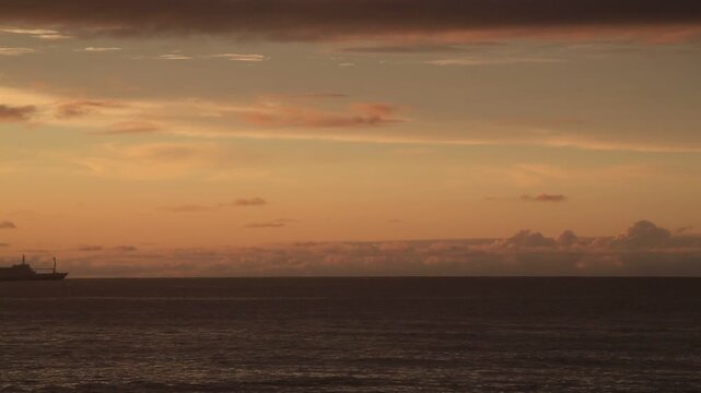 Sunset over the East China Sea with rocky coast in Amami Oshima, Japan