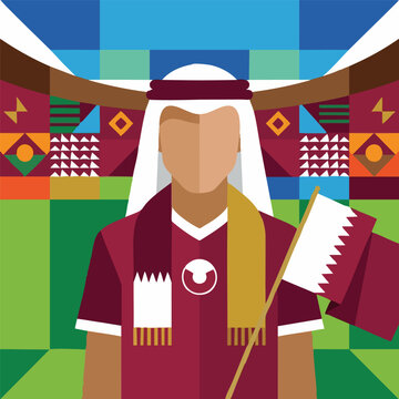 Qatari football fan in traditional attire holding flags at a stadium
