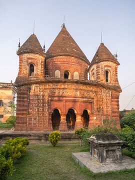 Vertical late afternoon view of ancient brick and terracotta pancharatna Govinda temple, Puthia, Rajshahi, Bangladesh
