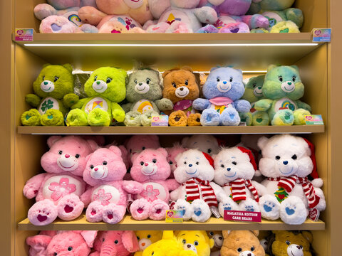 KUALA LUMPUR, MALAYSIA - FEB 02, 2026: Care Bears plush toys displayed on retail store shelf in colorful stuffed animal collection.