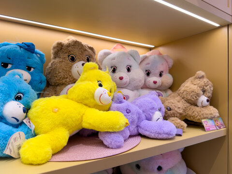 KUALA LUMPUR, MALAYSIA - FEB 02, 2026: Close up of colorful Care Bears plush toys displayed on retail store shelf in character merchandise section.