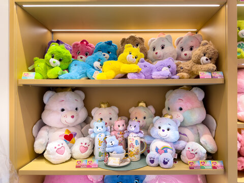 KUALA LUMPUR, MALAYSIA - FEB 02, 2026: Care Bears plush toys and themed merchandise displayed on retail store shelves in colorful character collection.