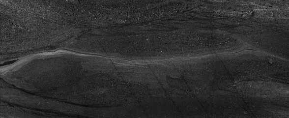 Black marble stone texture. Dark abstract background. © Vidal