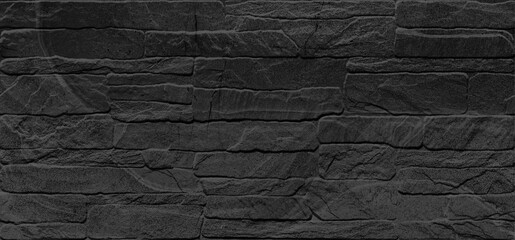 Dark ideal stones of the wall. Imitation of natural stone for decorated of the facade of a building. © Vidal