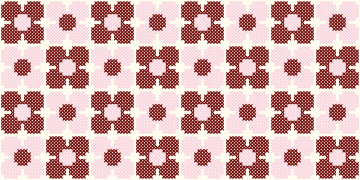 Cross stitch seamless pattern with pink and burgundy floral motifs on a cream background