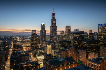Fototapeta premium Aerial view of the night skyline of tall buildings in the city of Chicago, USA