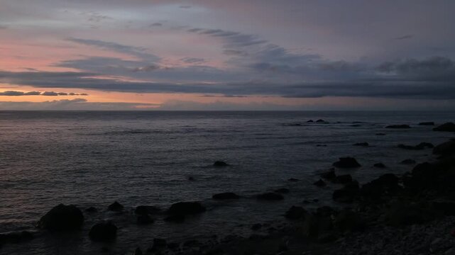 Sunset over the East China Sea with rocky coast in Amami Oshima, Japan
