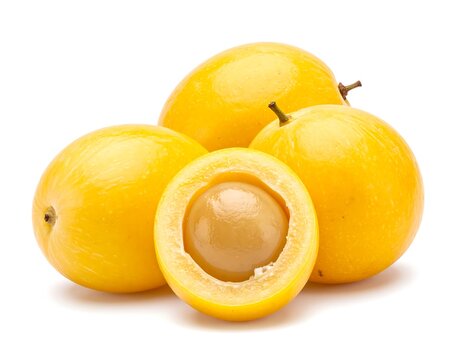 Whole and halved marula fruits, showing juicy yellow flesh