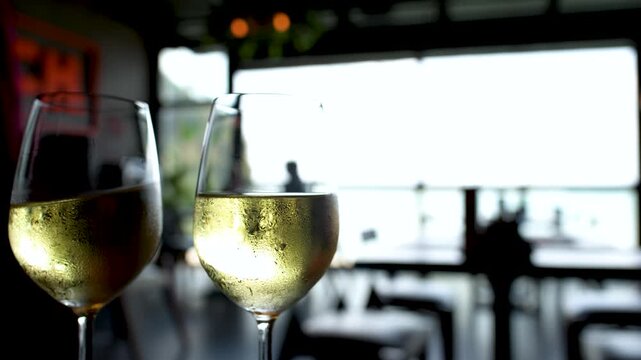 Chilled White Wine Glasses on an Outdoor Restaurant Patio Table