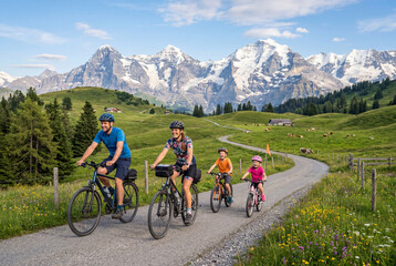 Fototapeta premium Cheerful family on a bicycle ride through mountain range