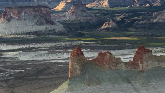 Aerial view of Bozjyra limestone cliffs and white chalk mountains in the desert valley of Aktau, Mangystau Region, Kazakhstan.