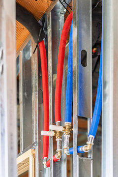 New pex plumbing pipes installed in metal stud wall