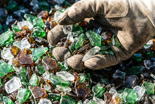 Glass recycling sorting hand inspection green broken cullet sustainable waste management circular economy worker