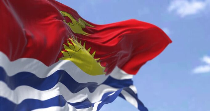 Close-up of Kiribati national flag waving in the wind. Kiribati is an independent island nation in the central Pacific Ocean. Seamless 3d render animation. Slow motion loop. Selective focus