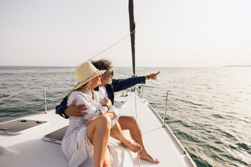 Senior couple sailing enjoying ocean view on yacht vacation © Jordi Salas