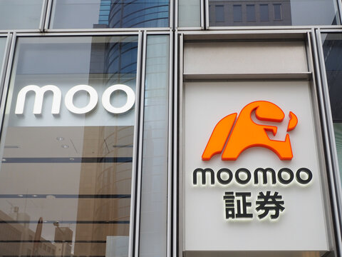 TOKYO, JAPAN - May 6, 2026: Sign on a branch of the investment platform company Moomoo in Tokyo.