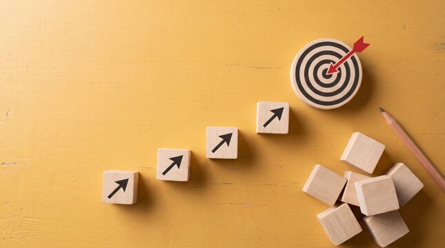 Wooden blocks form an ascending staircase towards a target, symbolizing career growth and success.