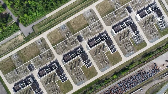 Aerial top down view of electrical power substation infrastructure