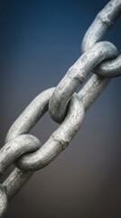 Naklejka premium Close-Up of Metallic Chain Links Metal Links Close-Up Texture Strength Industrial Hardware. Concept featuring metal, links, close-up, texture, strength for professional commercial design.