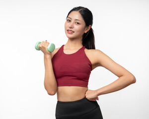 Naklejka premium Young beautiful asian woman with red sportswear exercises workout with dumbbells on isolated white background. Portrait happy healthy slim fit and firm latin attractive sporty woman weight training