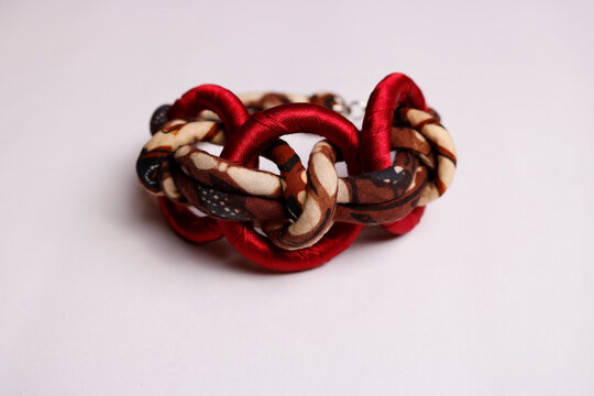 Handmade Interlocking Red Silk and Brown Batik Ring Bracelet
