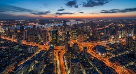 Obraz premium Cityscape illuminated nighttime aerial view