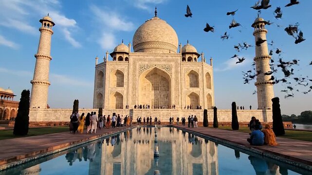 Taj Mahal Mausoleum In Agra India At Sunset With White Marble Architecture And Birds Flying Over Reflecting Pool