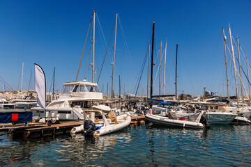 Fototapeta premium Variety of boats and yachts moored at a busy harbor in Malta