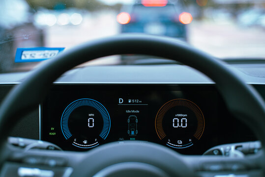Idle Mode Traffic Telemetry. System activates tracking algorithms while paused during active driving. Glowing digital schematics contrast sharply against smooth bokeh from red brake lights