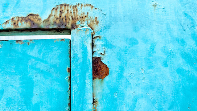 Abstract turquoise metal texture with heavy rust and peeling paint