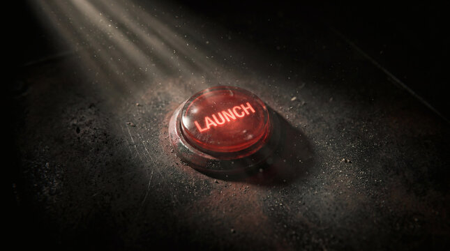 Cinematic Glowing Red Launch Button on Gritty Metal Surface