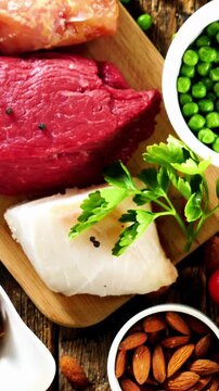 assorted high protein food sources including raw beef white fish poultry and vegetables