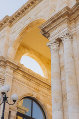Bastion of Saint Remy, Cagliari architecture showcasing neoclassical details, arched openings, and historic stone columns © anatoliycherkas