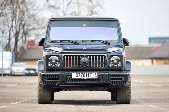 Minsk, Belarus - March, 17 2026: Mercedes-AMG G 63 Edition 1 features a 4.0L V8 biturbo engine with 585 hp. Matte black Magno finish with red accents on wheels grill and mirror caps, urban background