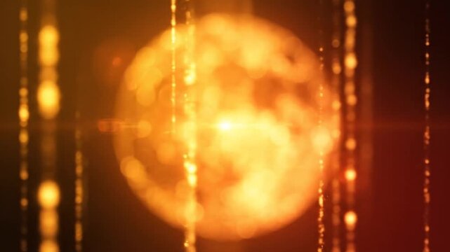 Glowing orange light abstract background with bokeh.