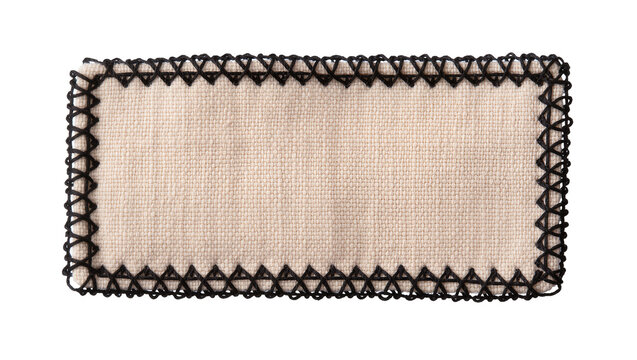 Rectangular beige fabric swatch with black decorative stitching, isolated on transparent background