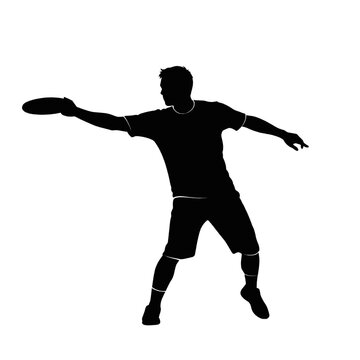 Silhouette of a man throwing a frisbee disc during a game of ultimate frisbee.