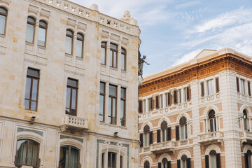 Fototapeta premium Historic buildings architecture in Cagliari, Sardinia, Italy, featuring classic European city facades and sky